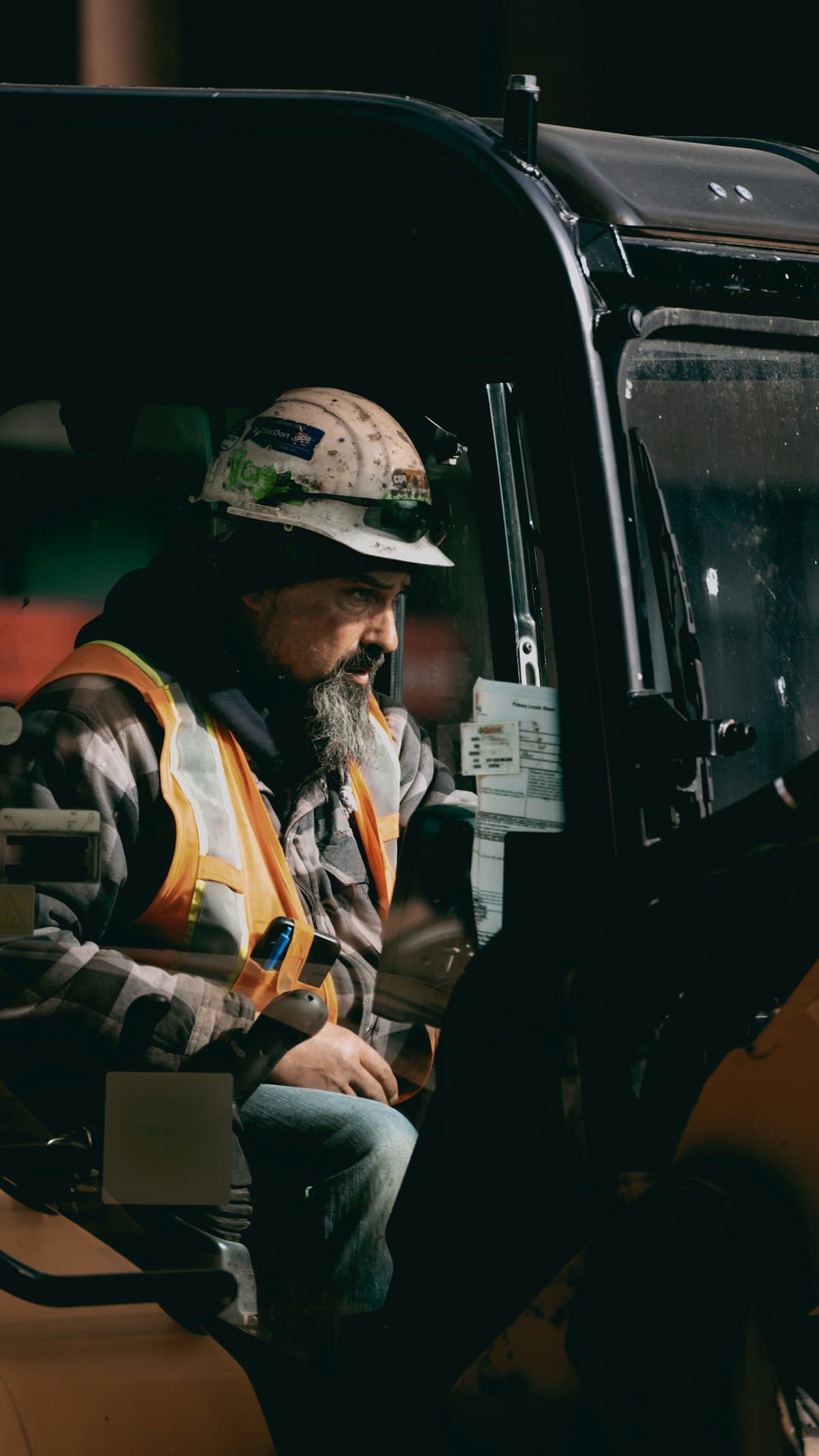 A contractor sitting in his work truck between jobs