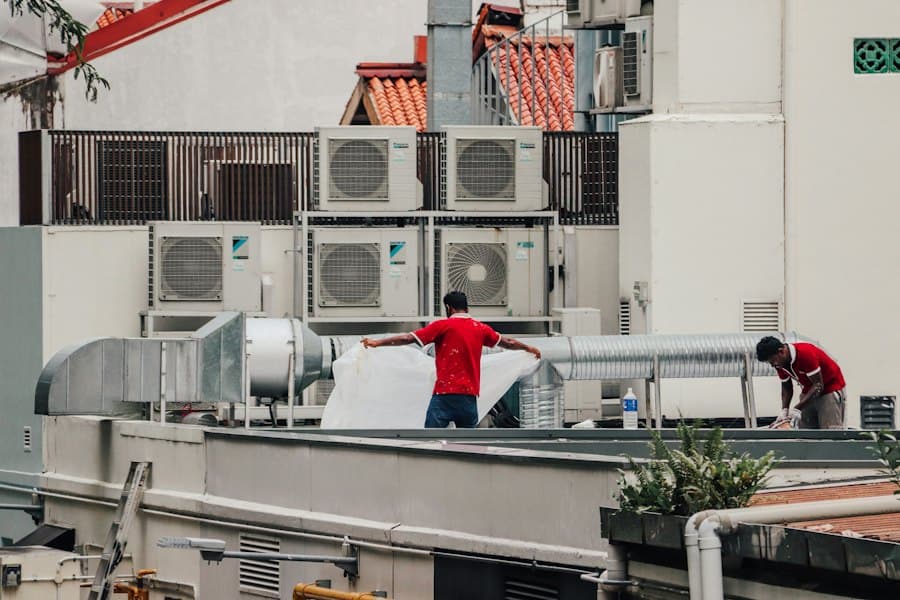 Technicians working on rooftop units